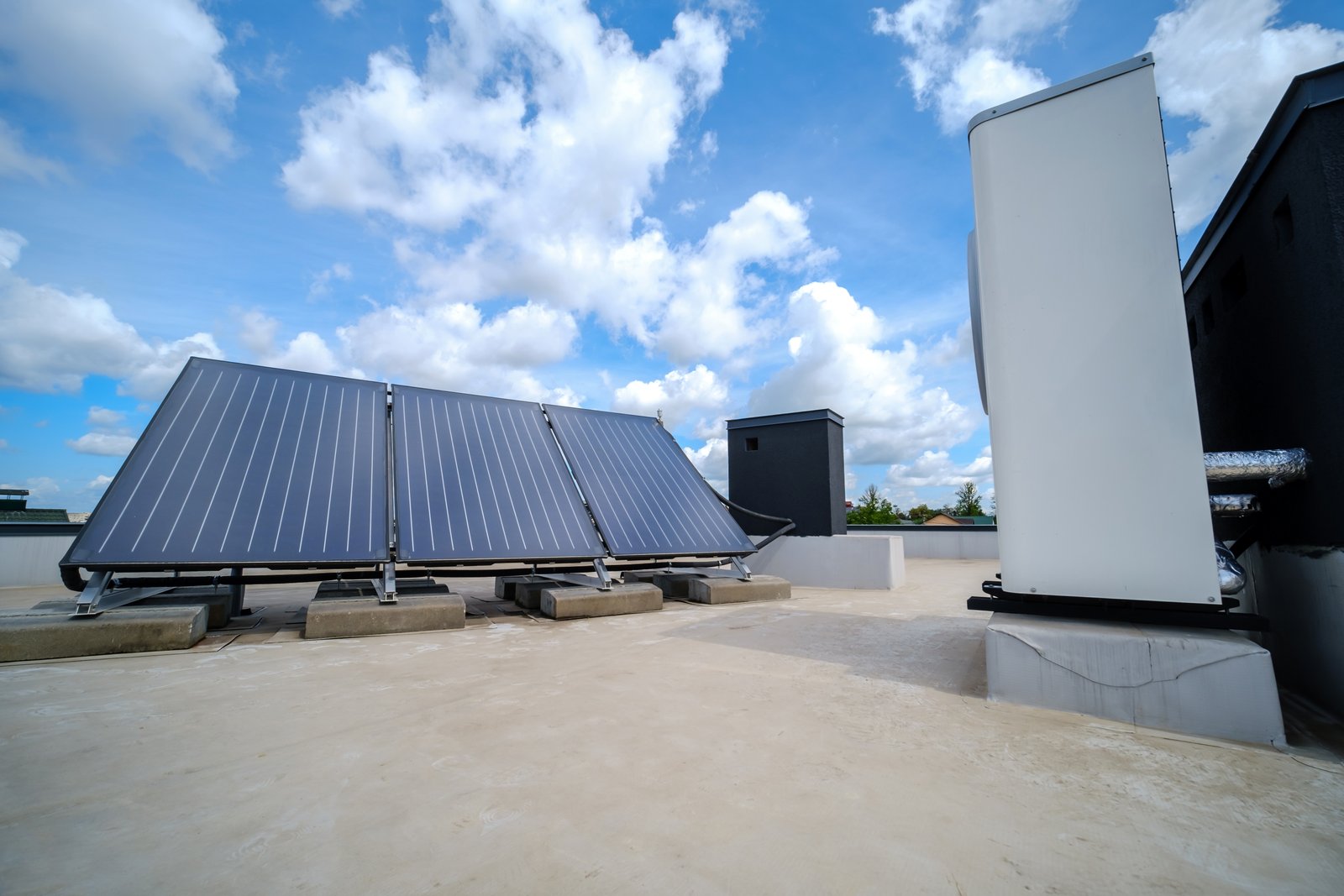 Solar panels and cooling units on a commercial building roof